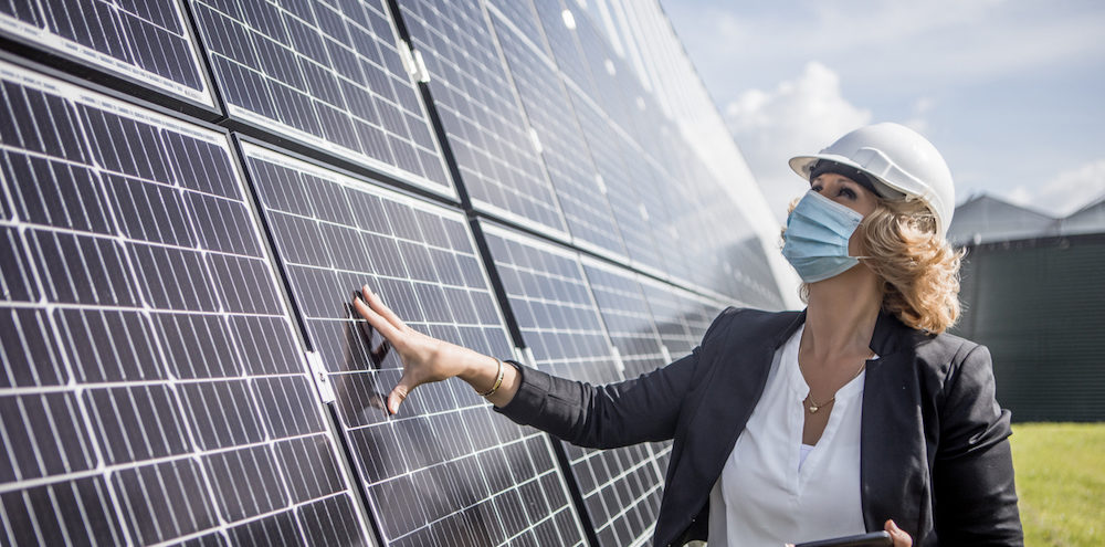 iStock-1298677118-solar-woman-e1617212159761.jpg